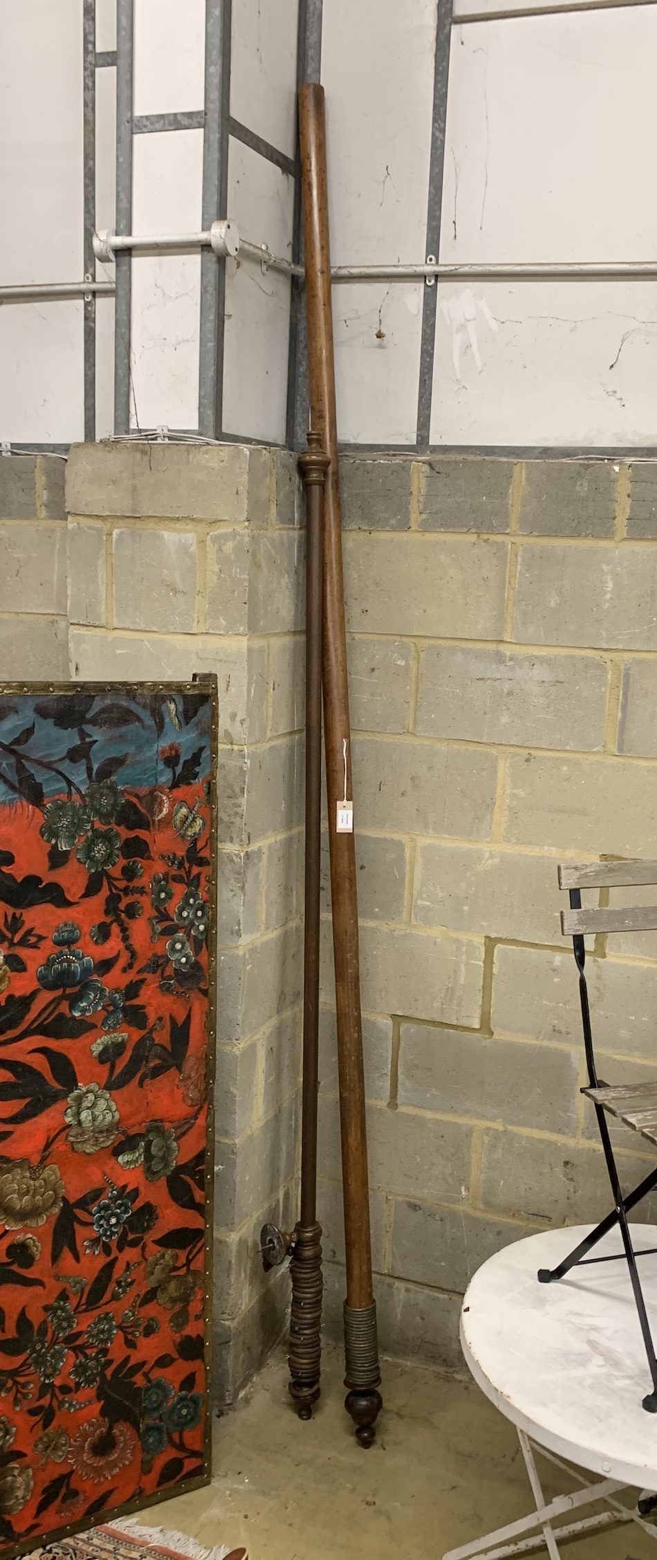 A Victorian mahogany curtain pole and rings, length approx. 300cm together with a smaller later curtain pole with rings
